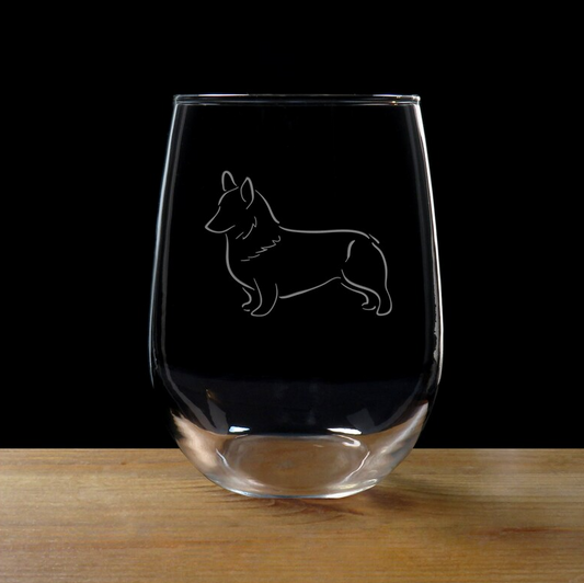 Sand-etched corgi on a clear stemless wineglass with a black background